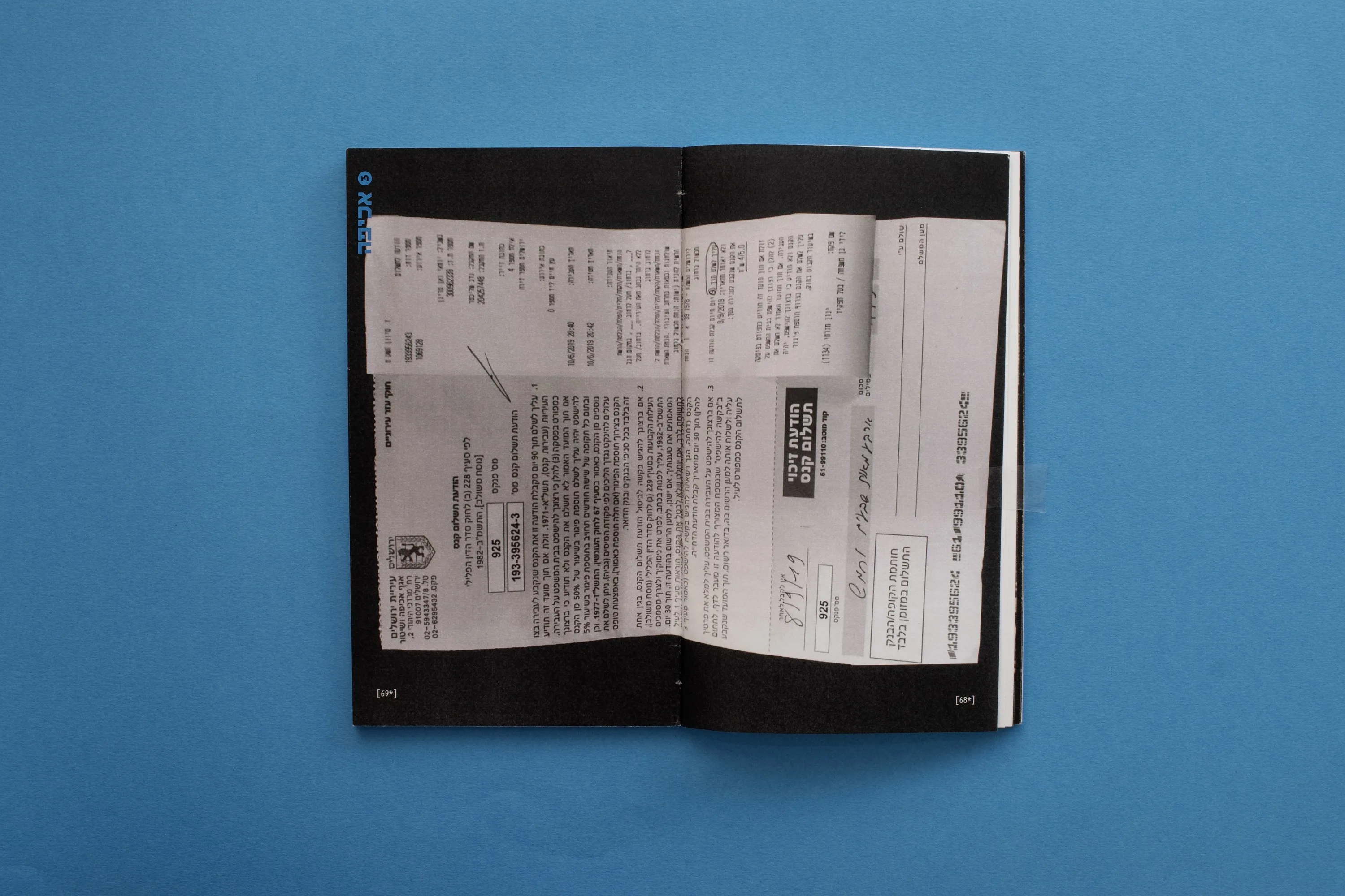 A black spread with a crumpled fine notice